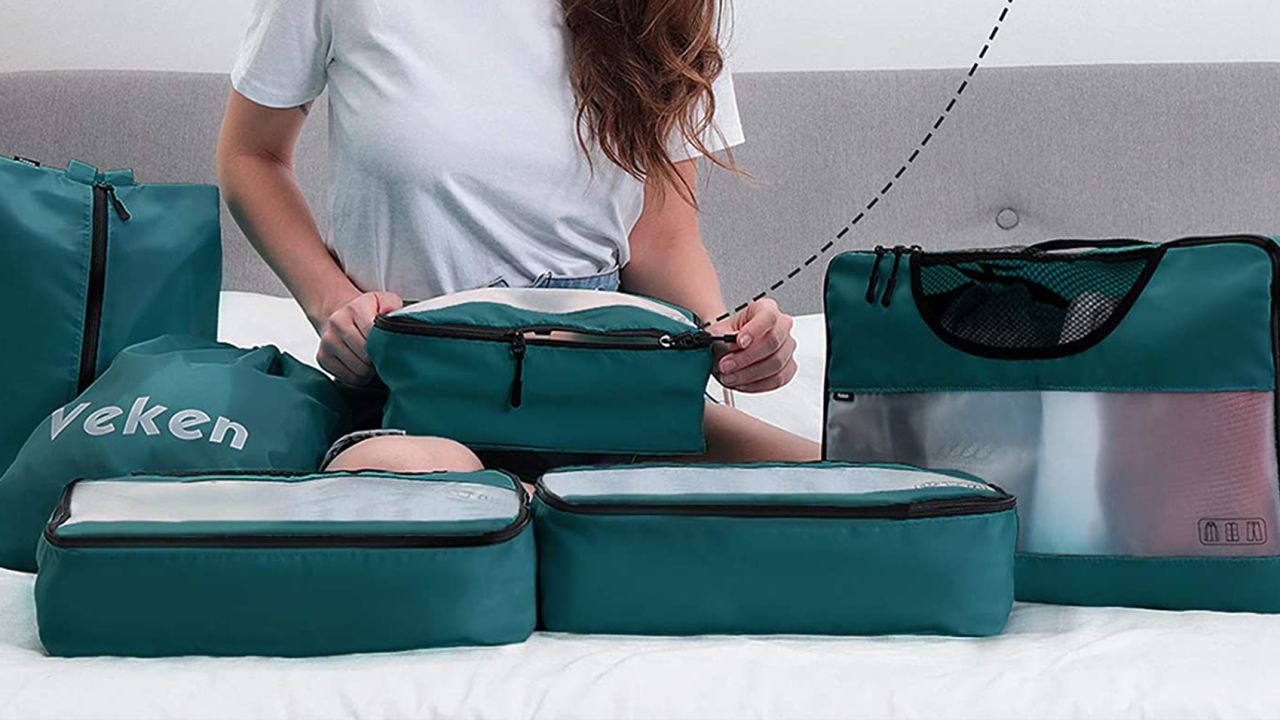 Person using packing cubes