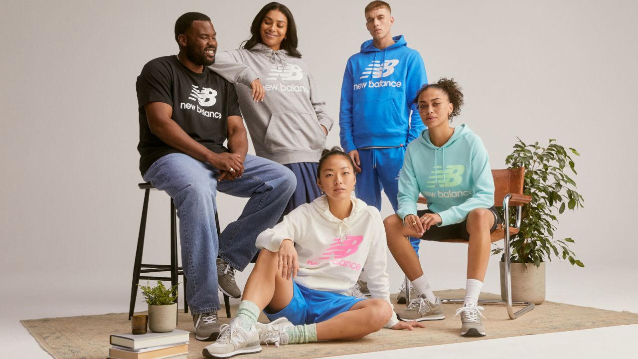 Group of people wearing New Balance tops.