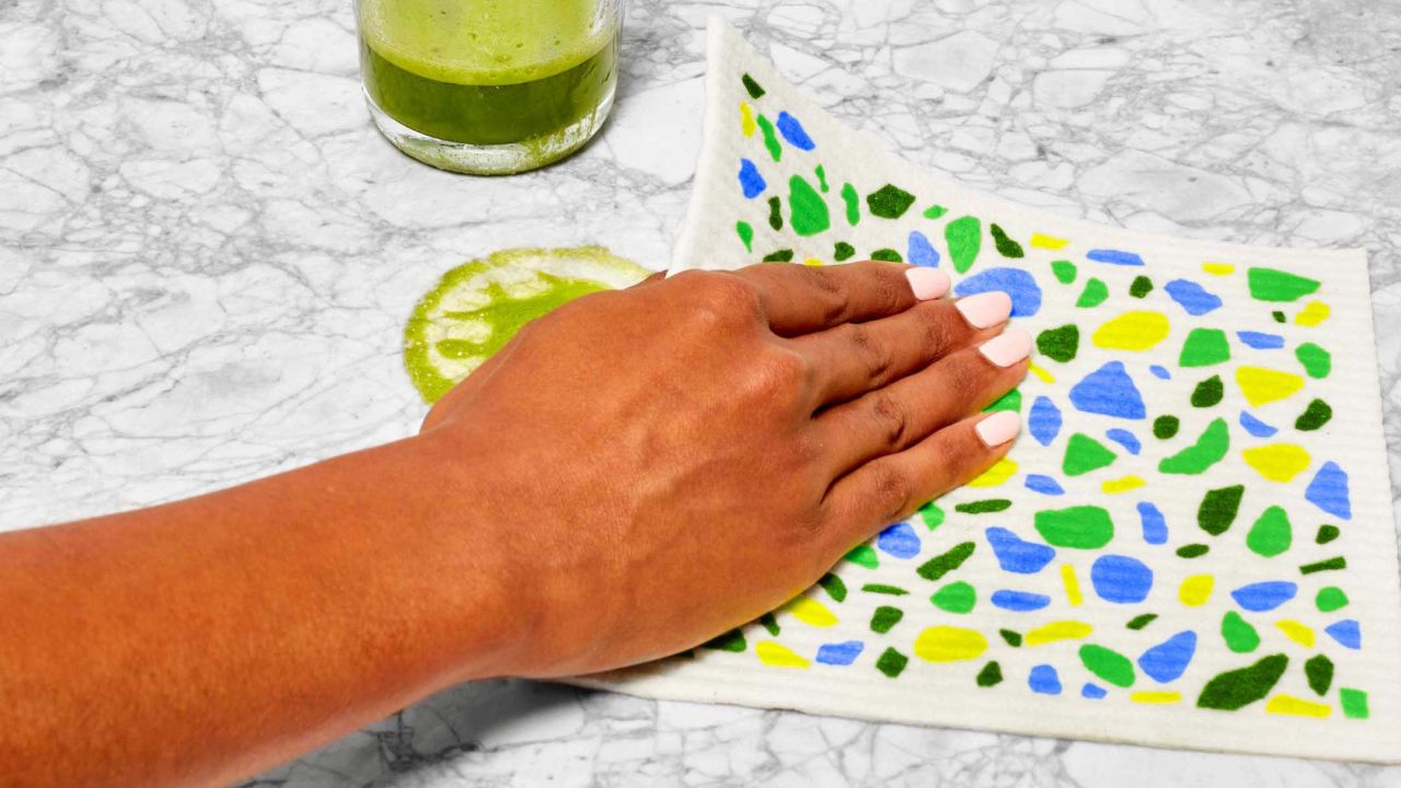 Person using Swedish Dishcloth Person using Swedish Dishcloth