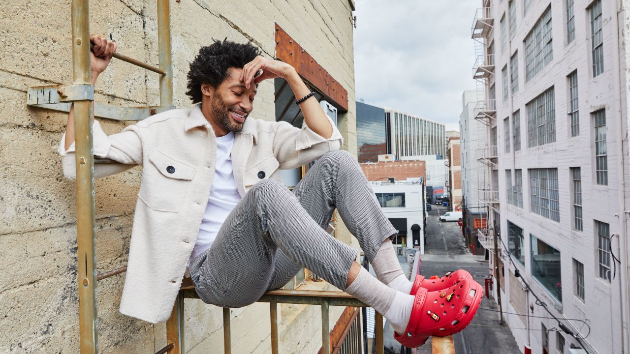 Person wearing red Crocs Person wearing red Crocs