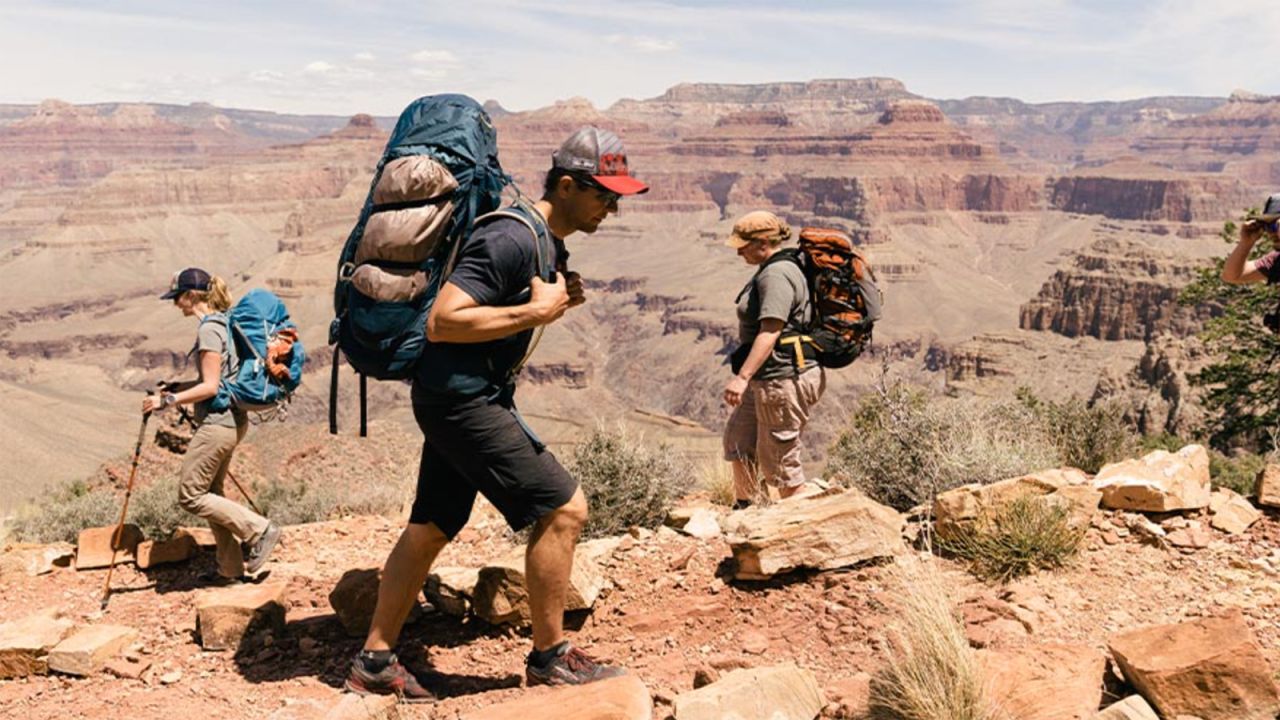 People hiking with REI gear