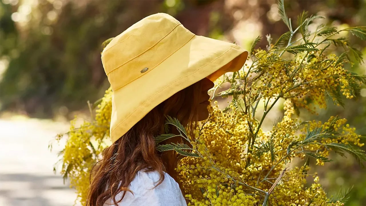 Person wearing a yellow sun hat