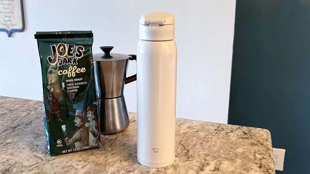 Travel coffee mug and coffee